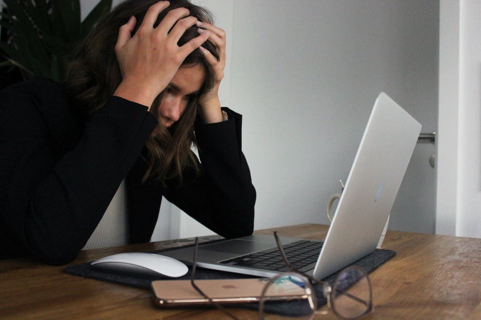 Stressed professional dealing with repetitive document creation tasks