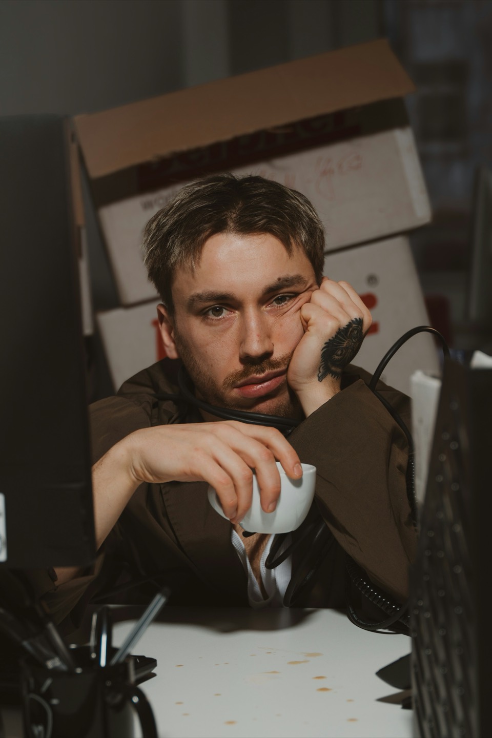 Tired professional dealing with repetitive daily tasks at desk